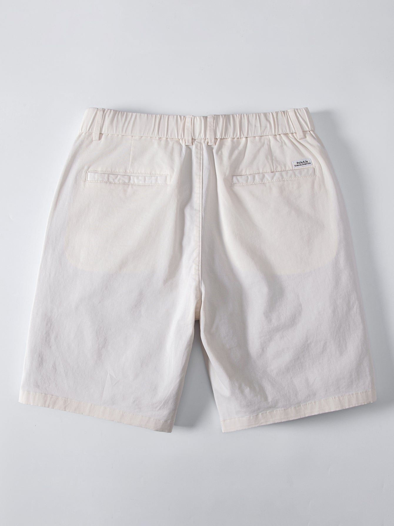 Beiget chino-shortsit joustavalla vyötäröllä takaa