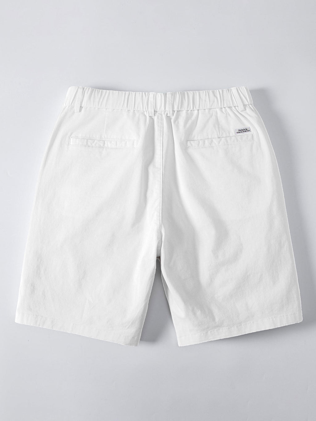 Valkoiset chino-shortsit joustavalla vyötäröllä takaa