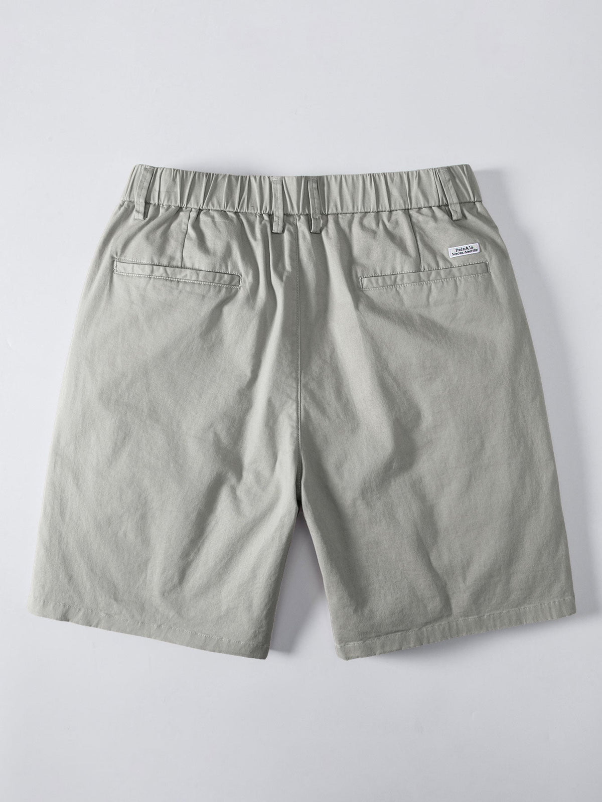 Vaaleanvihreät chino-shortsit joustavalla vyötäröllä takaa