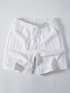 Valkoiset palmikkojacquard-shortsit kiristysnyörillä, tuotekuva edestä