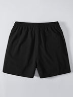 Mustat kreppipintaiset shortsit takaa