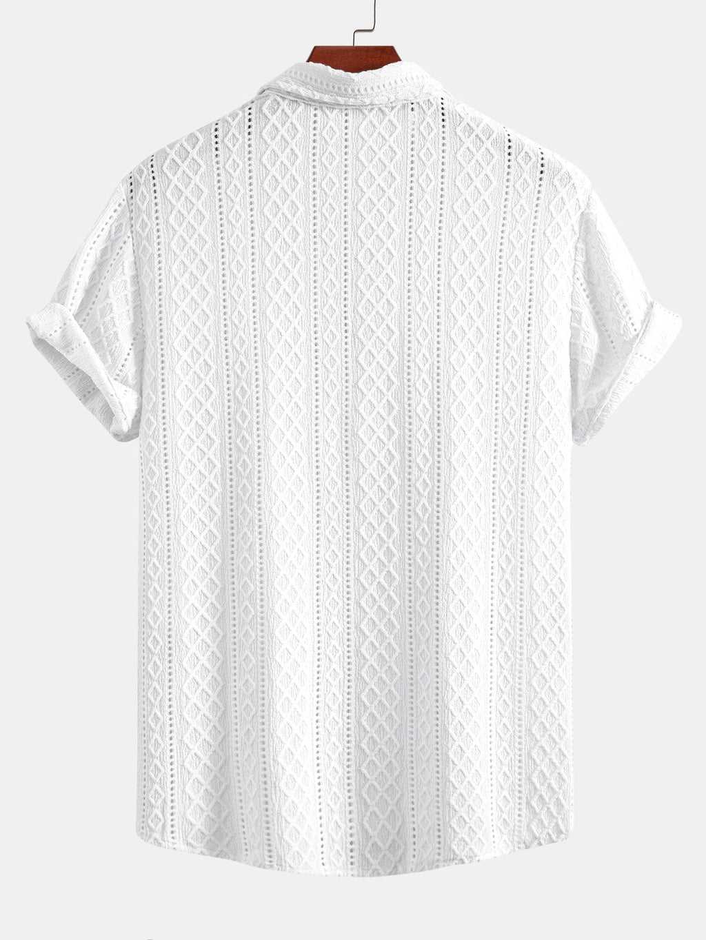 Kahvinruskean jacquard-paidan vinoneliökuvion lähikuva.