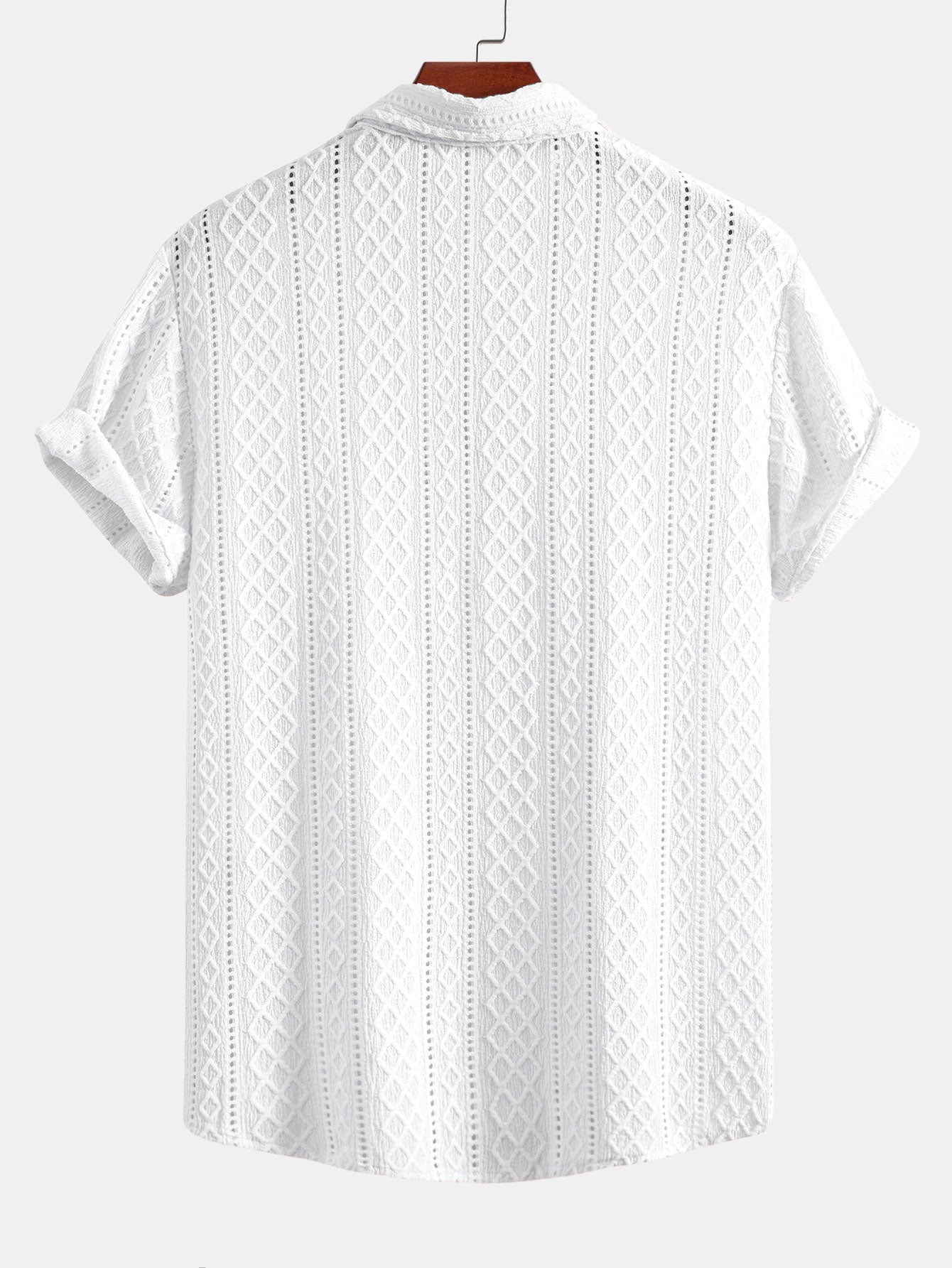 Kahvinruskean jacquard-paidan vinoneliökuvion lähikuva.
