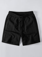 Mustat palmikkojacquard-shortsit kiristysnyörillä, tuotekuva edestä