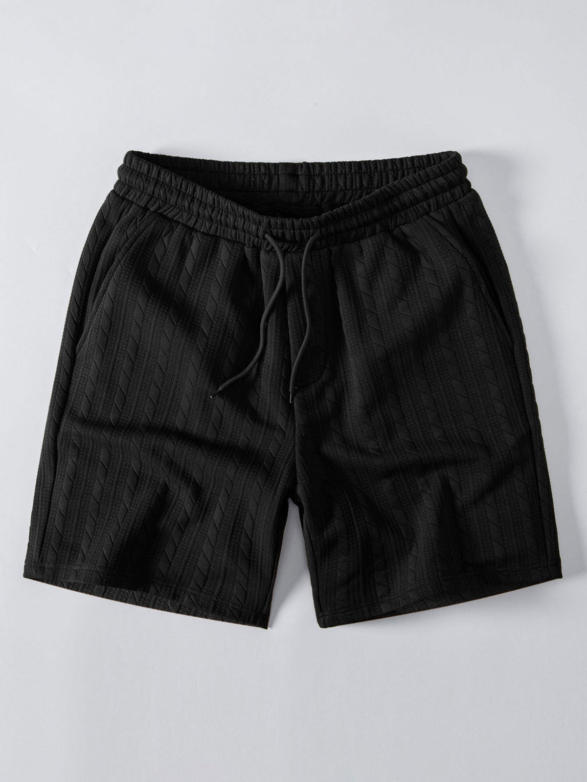 Mustat palmikkojacquard-shortsit kiristysnyörillä, tuotekuva edestä